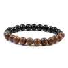 Pulsera de Madera Natural Hecha a Mano y Piedra Volcánica con Diseño de Rayas Negras y Marrones Perfecta para Estilo Casual y Bohemio Ideal para Hombres y Mujeres Pieza de Joyería de Moda para Uso Diario y Regalo