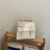 Mochila Novedad Primavera 2026 Estilo Coreano Nicho Linda con Relieve para Mujer, Bolso de Mano Versátil Ligero para Viajes