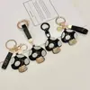 Chaveiro criativo em formato de cogumelo, transfronteiriço, leve e luxuoso, com adornos de diamante, material de PU moderno, charmoso de bolsa requintado estilo coreano e japonês, e um acessório fofo para meninas