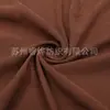Venta al por mayor de tela de terciopelo coreano tejida, terciopelo elástico, tela abrasiva, terciopelo coreano, almohada cervical en forma de U, terciopelo coreano