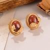 Aretes Ovalados de Textura Alta de Época Antigua Media Otoño e Invierno Rojo Vino Diseño Nicho Lujo Ligero Aretes de Gama Alta