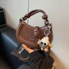 Outono e inverno nova bolsa pequena feminina 2024 textura de alta qualidade bolsa de sela portátil elegante retrô all-match estilo ocidental bolsa crossbody
