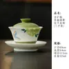 Juego de té de cerámica pintado a mano bajo vidriado con motivos de mariposas y flores, que incluye un gaiwan, tetera, taza de té, platillo, posavasos y vaso de agua