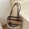 Bolso de axila retro estilo chica caliente Shuai Mi Jia para mujer, nuevo bolso de mano para el día a día 2026, bolso baguette, bolso de hombro texturizado