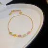 [Cadena de Diamantes Arcoíris] Pulsera de extracción de zircón trenzado en cruz, una pulsera lujosa y de alta gama, una pieza de joyería delicada y de moda