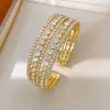 Pulsera redonda abierta multicapa con adornos de diamantes, versátil para el uso diario, joyería de nicho de lujo ligero de alta gama para mujer al por mayor