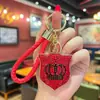 Llavero creativo nuevo de arcilla de una cara con escudo y corona incrustados de diamantes, moderno diseño europeo y americano personalizado, colgante para bolso