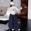 Conjunto Infantil Coleção Outono 2026: Conjunto de Duas Peças T-shirt com Estampa de Laço e Calça Pantalona para Crianças de Tamanho Médio e Grande, Roupa de Outono Estilo Coreano para Crianças