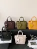 2026 popular nuevo bolso de hombro cruzado con textura de moda, bolso de mano tipo cubo vintage de gran capacidad con textura para mujer