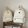 Nueva mochila con relieve en forma de corazón transfronteriza para estudiantes, bolsa ligera para viajes diarios, mochila pequeña de nicho de lujo ligero