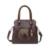Bolso de Mano de Estilo Étnico Transfronterizo de Nicho Retro para Mujer 2026 Nuevo Bolso Cubo de Textura de Alta Calidad Bolso de Hombro Cruzado