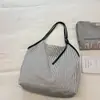 Bolso de mujer a rayas 2026 nuevo otoño casual estudiante universitario clase commute bolso tote gran capacidad bolso de hombro
