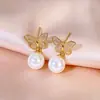 Moda Luxo Leve Exquisite Pingente Borboleta Micro-Incustado Zircônia Brincos de Pérola, Versátil e Elegante, Brincos de Alta Qualidade Super Feéricos Atacado