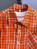 Camisa de rayas arrugadas de lujo ligero estilo coreano para hombre, camisa texturizada de manga corta holgada, camisa para ir al trabajo, naranja