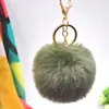 Al por mayor en stock Bola de pelo de imitación de conejo Rex de 8 cm llavero colgante lindo para mujer bolso de coche teléfono móvil colgante de felpa