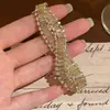 Pulsera abierta multicapa de circón súper brillante metálico de moda, estilo europeo y americano versátil y elegante, joyería de diseño de nicho