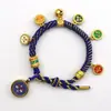 Pulsera tejida a mano estilo Tíbet con Cinco Deidades de la Riqueza, Pulsera Thangka, Colgante Ojo del Dharma del Dios de la Riqueza, Pulsera de Hilo Rojo con Cascabel