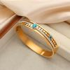 Francés Nuevo estilo retro lujo ligero estilo compuesto acero de titanio chapado en oro de 18 quilates hueco diamante turquesa pulsera joyería al por mayor