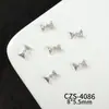 Accesorios de plata populares para manicura estilo francés, accesorios versátiles de alta gama de lujo ligero con forma de corazón y mariposa huecos con incrustaciones de diamantes para uñas