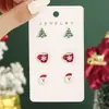 Nuevo conjunto de pendientes navideños de tres piezas para mujer transfronterizo: Aretes combinados de Santa Claus, copo de nieve y taza roja, lindos y compactos