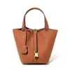 Bolsa 2024 Novo Balde Saco Cesta de Alimentos Bolsa Feminina Bolsa de Couro Genuíno Bolsa Múmia Bolsa de Casamento Noiva Bolsa de Casamento High-end Sense