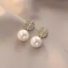 Pendientes de plata de ley S925 con circonita ultra brillante de alta gama para mujer, lujo ligero, exquisitos y elegantes, pendientes de botón populares al por mayor, estilo festivo