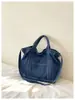 Bolso de mezclilla grande personalizado estilo retro para mujer, nueva colección otoño/invierno 2026, bolso cruzado o de hombro moderno y casual