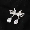 Exquisitos Pendientes de Zirconia en Forma de Gota de Agua con Línea Hueca de Colores, Simétricos y Brillantes, Pendientes de Moda Europeos y Americanos Tendencia para Mujer