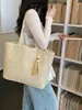 Bolso tejido de paja de gran capacidad para mujer, nuevo modelo 2026, versátil para ir al trabajo, bolso tejido de mano y al hombro, bolso de playa para vacaciones en la costa