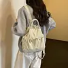 Mochila ligera estudiante gran capacidad doble hombro bolsa nicho estilo coreano 2026 Otoño nuevo simple ins bandolera mujer