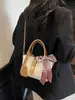 Bolsas pequeñas transfronterizas populares para mujer de este año, nuevos bolsos cruzados versátiles de moda para el verano de 2026, bolsos tipo cubo de estilo coreano