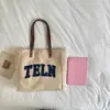 Nova mochila versátil de alta qualidade 2026, apresentando um estilo descontraído e doce, com uma bolsa tote de lona de grande capacidade adequada para uso casual e no trabalho.