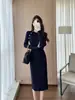 Vestido de punto de alta gama para mujer en Shenzhen, nuevo para otoño e invierno, falda suéter ajustada al cuerpo de manga larga, color azul zafiro