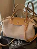 Bolso pequeño de alta gama transfronterizo para mujer, estilo verano 2026, moderno y sencillo, bolso tipo empanada de nicho, bolso versátil para hombro y cruzado