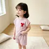 Nueva ropa para niñas de comercio exterior transfronterizo: conjunto de camiseta de rayas con top de lazo y shorts, conjunto sencillo de dos piezas de manga corta para niños