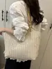 Bolsa de Grande Capacidade Feminina Verão 2025 Nova Bolsa de Palha Tecida à Mão Bolsa de Ombro para Deslocamento Bolsa de Praia para Férias à Beira-Mar
