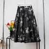 Falda acampanada con estampado en relieve estilo europeo y americano, falda midi de cintura alta línea A, diseño ligeramente abullonado para acentuar la cintura y estilizar las caderas, falda jacquard con patrón intrincado para mujer