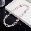 Elegante collar largo de perlas estilo coreano para mujer, versátil para otoño e invierno, exquisita cadena para suéter, colgante de letra simple y único, venta al por mayor
