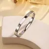Pulseira de aço titânio transfronteiriça moda simples feminina europeia e americana banhada a forno ouro real 18K aço inoxidável 6mm pulseira lisa