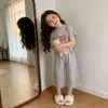 Conjunto de Verano Estilo Coreano para Niñas, Dulce Forma de Corazón con Cara Sonriente, Nuevo Top de Manga Corta, Elegante Conjunto de Dos Piezas para Niños con Pantalones Cortos