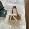 Nova bolsa balde de moda color-block transfronteiriça para o dia a dia, bolsa de palha listrada para praia, bolsa de ombro casual para viagem e bolsa tote