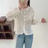 Colección Otoño 2026: Cuello de encaje estilo japonés, dobladillo abotonado de colores, blusa casual de manga larga con encaje para mujer