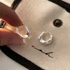 Pendientes de diseño de nicho, pendientes dorados de alta calidad, pendientes de estilo coreano, pendientes de gota de agua con viento frío, pendientes para mujer a juego.