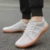 Zapatos Casuales Planos de Alta Venta Temu Aliexpress para Hombres y Mujeres, Tenis de Tejido Flyknit de Ajuste Amplio, Zapatos de Fitness para Parejas, Al por Mayor en Stock