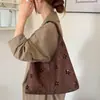 Bolso de Hombro Individual Hueco de Gamuza para Mujer 2026 Nuevo Vintage Versátil Gran Capacidad Casual Tote Bolso de Axila