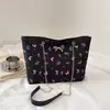 Bolso de mujer estilo graffiti 2026 nueva moda estudiante universitario viajero versátil bandolera bolsa de mano de gran capacidad