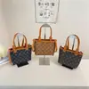 Bolso Pequeño 2025 Primavera y Verano Nuevo Versátil Moda Textura Nicho Bolso Cruzado Moda Femenina Bolso Cubo Femenino