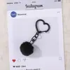Colgante de cuentas de rompecabezas, llavero de corazón con pompón de colores, decoración de peluche suave y linda, accesorio de llavero de cuentas de rompecabezas hecho a mano