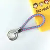 Chaveiro de corda trançada com anel duplo chaveiro de couro PU colorido novo pingente para bolsa feminina chaveiro para pendurar na cintura