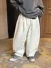 2026 Invierno Nuevo Estilo Coreano Versátil para Niños Más Terciopelo Pantalones Casuales para Niños y Niñas Holgados Casuales de Punto Cálidos Largos